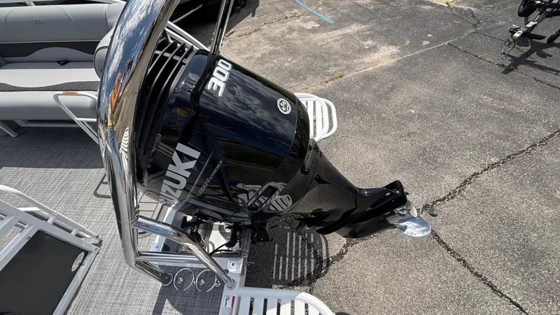 Slide: The Image of 2025 JC Neptoon 25TT Sport with Suzuki 300 outboard motor on a boat deck. - 15