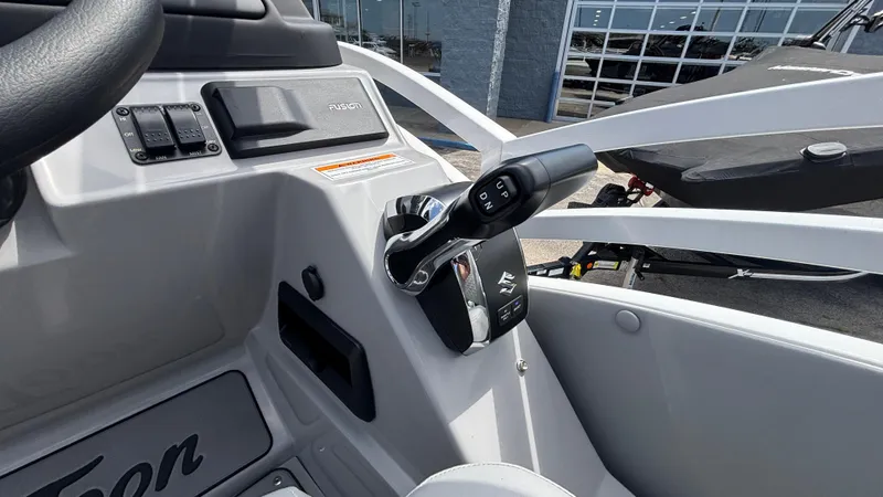 Slide: The Image of Control panel of 2025 JC Neptoon 25TT Sport boat with throttle lever and switches. - 22