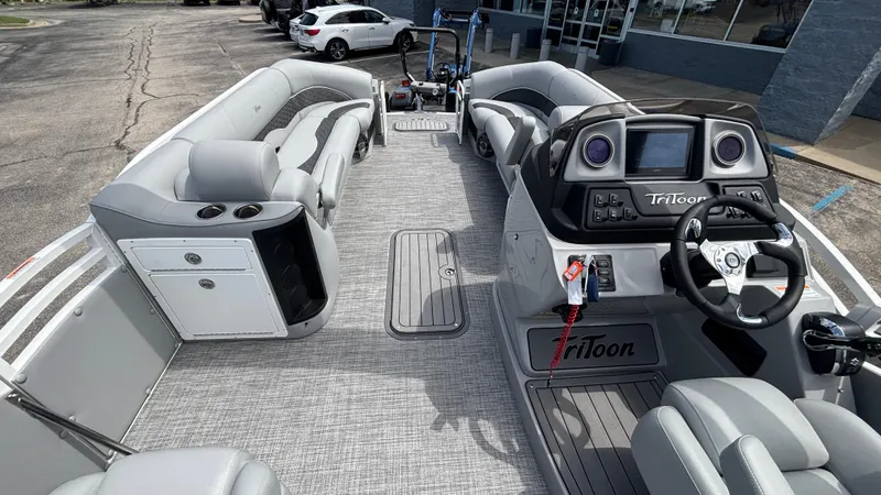Slide: The Image of 2025 JC Neptoon 25TT Sport pontoon boat interior with modern dashboard and seating. - 29