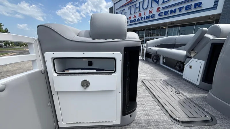 Slide: The Image of 2025 JC Neptoon 25TT Sport pontoon boat interior with seating and storage compartments. - 31