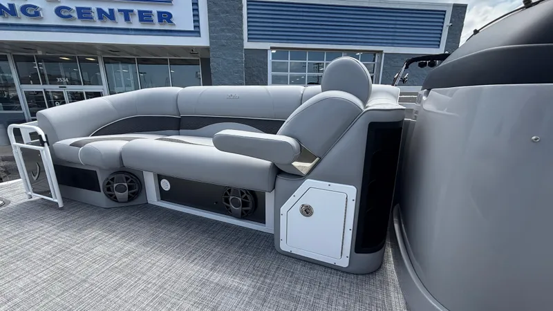 Slide: The Image of 2025 JC Neptoon 25TT Sport pontoon boat with gray seating and modern design. - 33