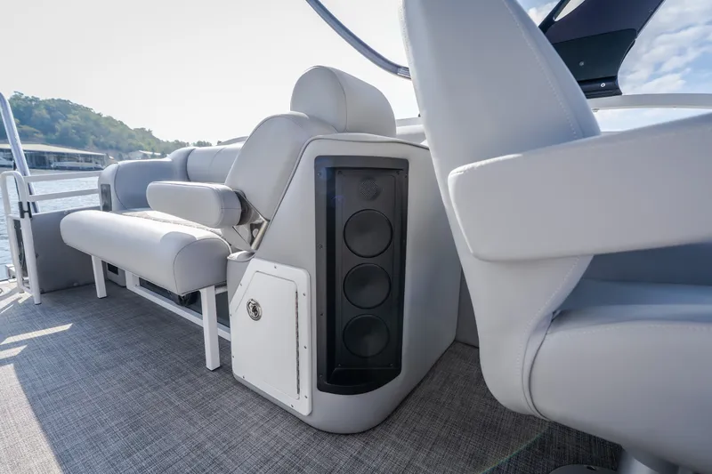 Slide: The Image of Luxury seating on 2025 JC Neptoon 25TT Sport boat with integrated speaker system. - 24
