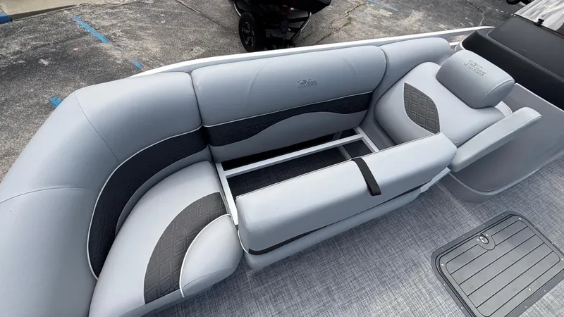 Slide: The Image of Luxurious seating on 2025 JC Neptoon 25TT Sport pontoon boat, featuring sleek gray upholstery. - 36