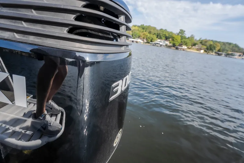 Slide: The Image of Close-up of JC Neptoon 25TT Sport 2025 boat engine on a lake. - 27