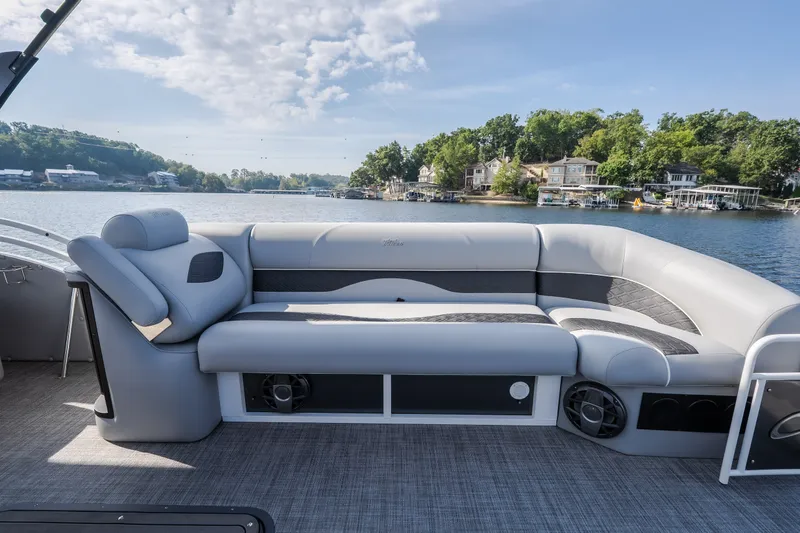 Slide: The Image of Luxurious seating on 2025 JC Neptoon 25TT Sport pontoon boat, with scenic lake view. - 39