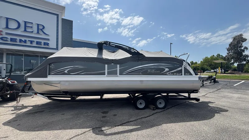 Slide: The Image of 2025 JC Neptoon 25TT Sport pontoon boat on trailer at dealership. - 6