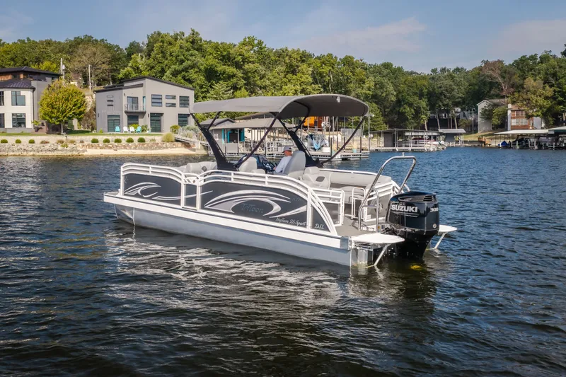 Slide: The Image of 2025 JC Neptoon 25TT Sport pontoon boat on a scenic lake. - 57