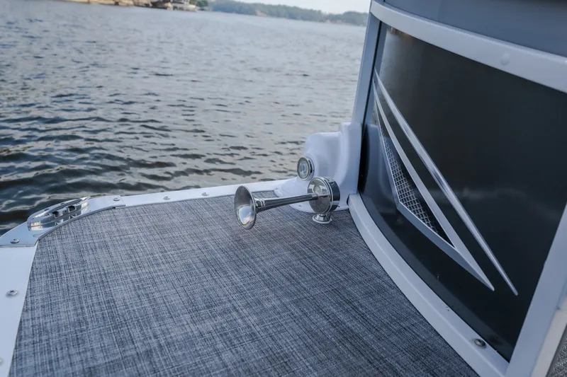 Slide: The Image of 2025 JC Neptoon 25TT Sport boat detail with sleek design on calm water. - 46