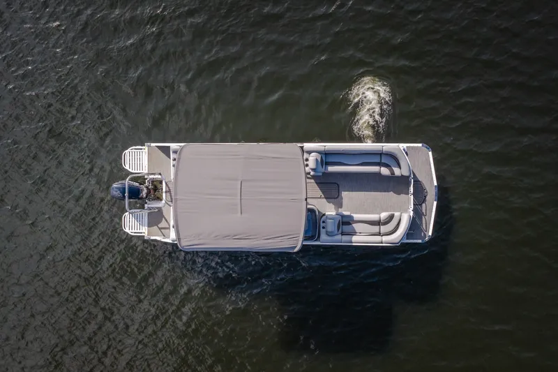 Slide: The Image of Aerial view of 2025 JC Neptoon 25TT Sport pontoon boat on water. - 15