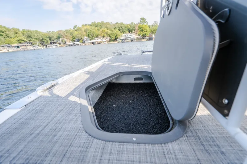 Slide: The Image of 2025 JC Neptoon 25TT Sport boat with open storage compartment on deck. - 47