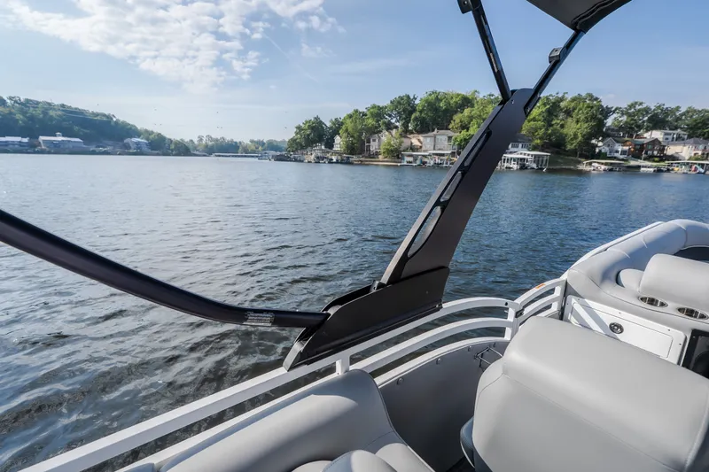 Slide: The Image of 2025 JC Neptoon 25TT Sport pontoon boat on a scenic lake. - 52