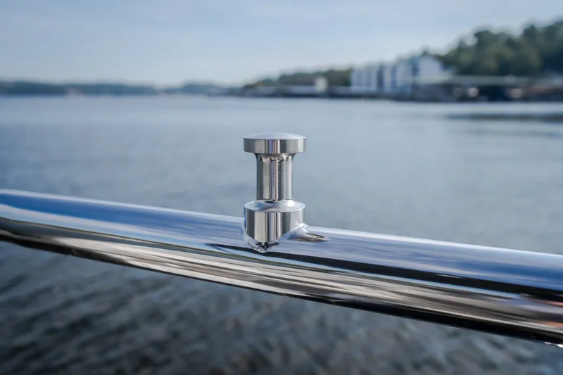 Slide: The Image of Stainless steel cleat on JC Neptoon 25TT Sport boat, 2025 model, with water background. - 26