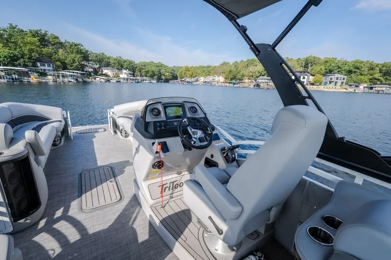 Slide: The Image of Interior view of 2025 JC Neptoon 25TT Sport pontoon boat on a scenic lake. - 35