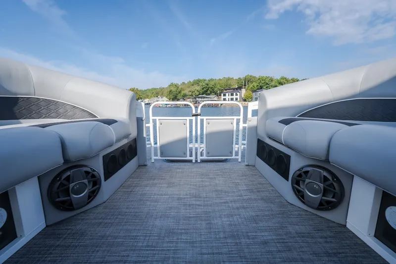 Slide: The Image of 2025 JC Neptoon 25TT Sport pontoon boat interior with plush seating and speakers. - 42