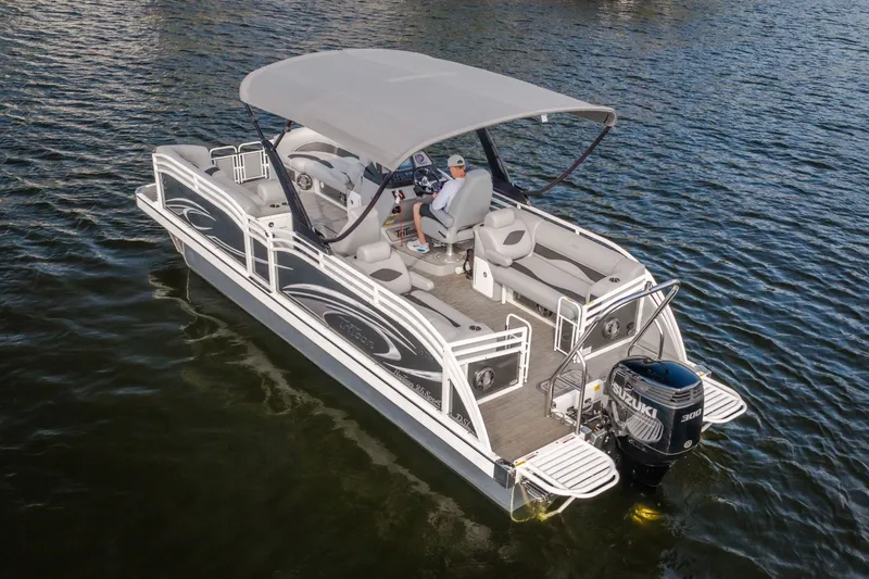 Slide: The Image of 2025 JC Neptoon 25TT Sport pontoon boat on water, featuring spacious seating and canopy. - 6