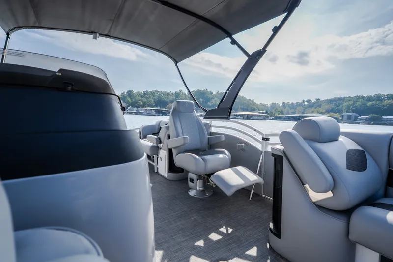 Slide: The Image of Interior of 2025 JC Neptoon 25TT Sport boat with luxurious seating and scenic lake view. - 19