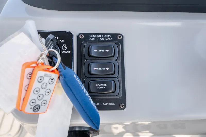 Slide: The Image of Control panel of 2025 JC Neptoon 25TT Sport with keys and remote. - 14