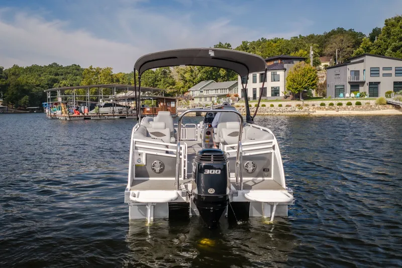 Slide: The Image of 2025 JC Neptoon 25TT Sport pontoon boat on a scenic lake. - 56