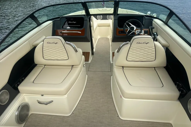 Slide: The Image of 2026 Chris-Craft Sportster 25 interior with luxurious seating and elegant dashboard design. - 17