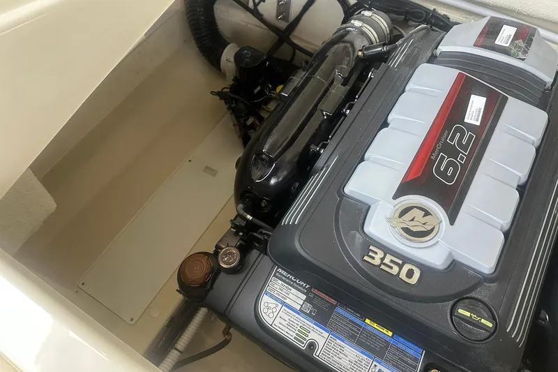Slide: The Image of 2026 Chris-Craft Sportster 25 engine compartment with 6.2L MerCruiser 350 engine. - 34