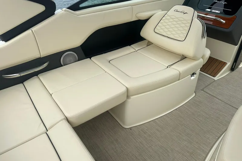 Slide: The Image of 2026 Chris-Craft Sportster 25 interior with luxurious cream seating and elegant design. - 31