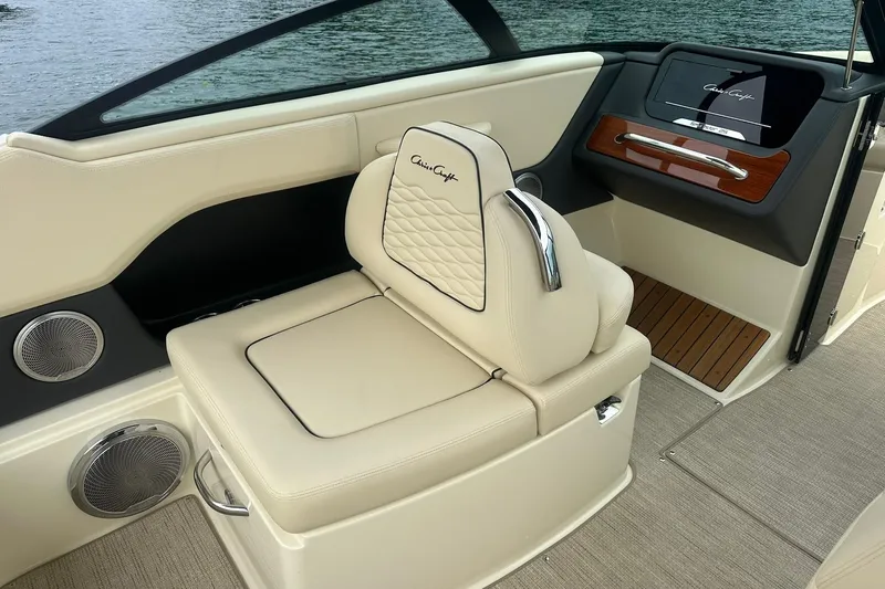 Slide: The Image of Luxurious interior of 2026 Chris-Craft Sportster 25 boat with elegant seating and dashboard. - 18
