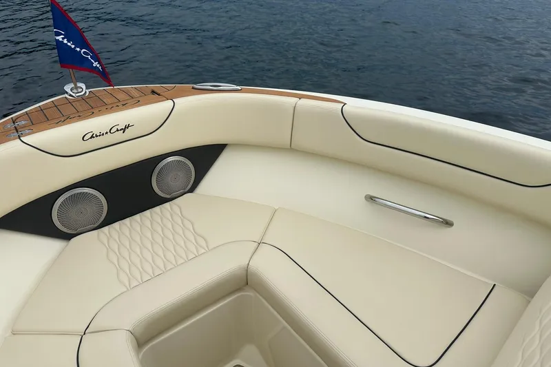 Slide: The Image of Luxurious interior of 2026 Chris-Craft Sportster 25 boat with elegant seating and speakers. - 24