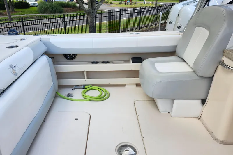 Slide: The Image of 2012 Grady-White Freedom 307 boat interior with seating and storage area. - 13