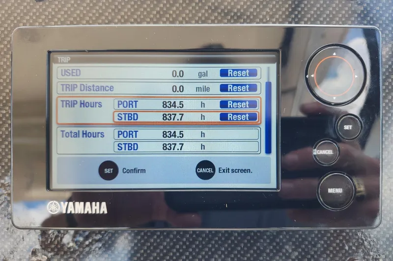 Slide: The Image of Yamaha display showing trip and total hours for Grady-White Freedom 307, 2012 model. - 19