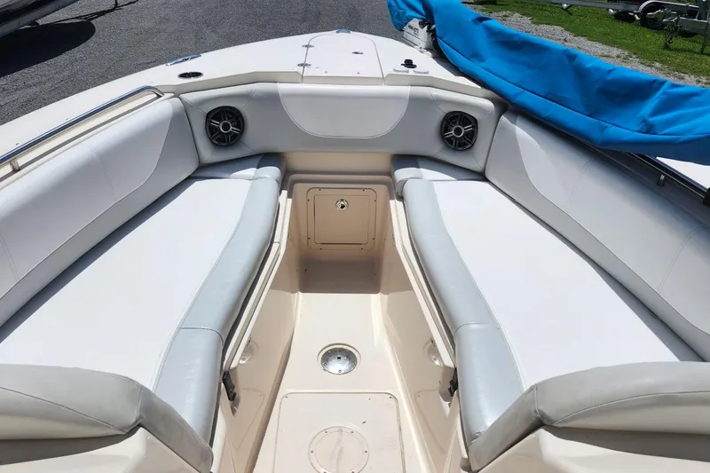 Slide: The Image of 2012 Grady-White Freedom 307 boat interior with cushioned seating and speakers. - 26