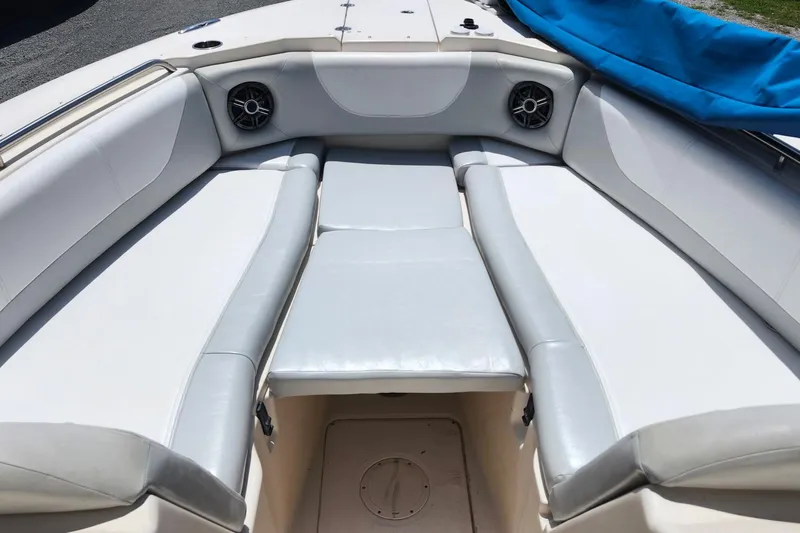 Slide: The Image of 2012 Grady-White Freedom 307 boat interior with cushioned seating and speakers. - 27
