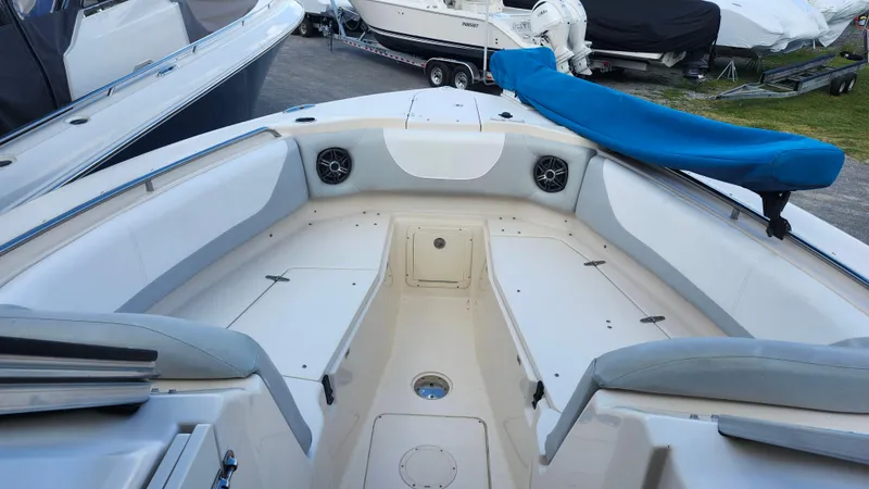 Slide: The Image of 2012 Grady-White Freedom 307 boat interior with spacious seating and covered equipment. - 28