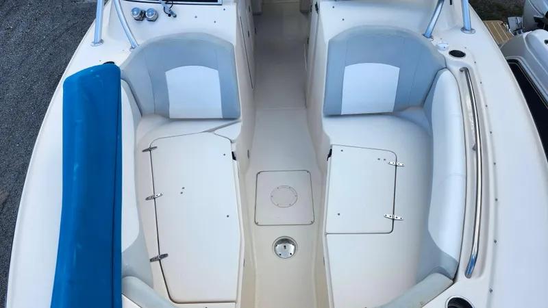 Slide: The Image of 2012 Grady-White Freedom 307 boat interior with seating and storage compartments. - 29