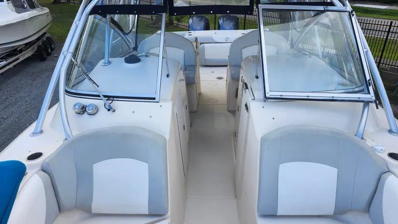 Slide: The Image of 2012 Grady-White Freedom 307 boat interior with seating and windshield. - 30