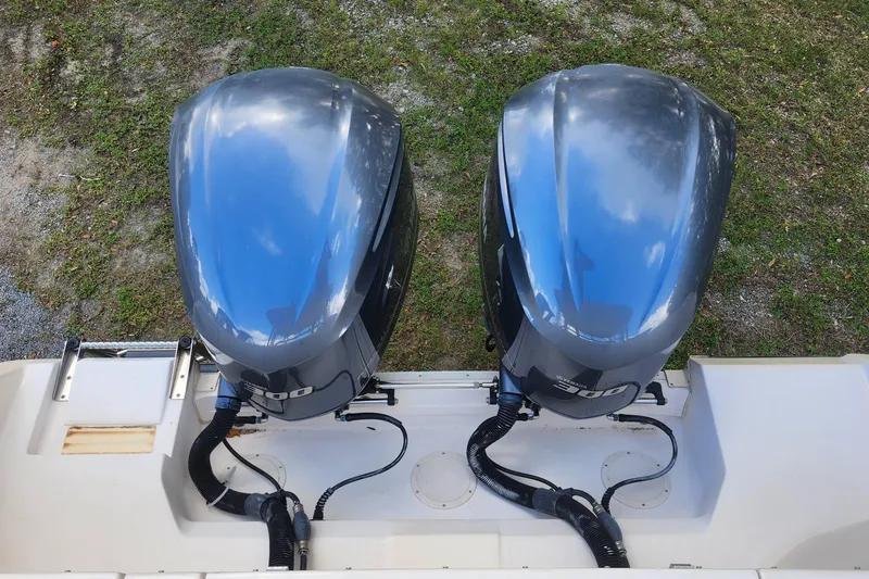 Slide: The Image of Twin outboard engines on a 2012 Grady-White Freedom 307 boat. - 31