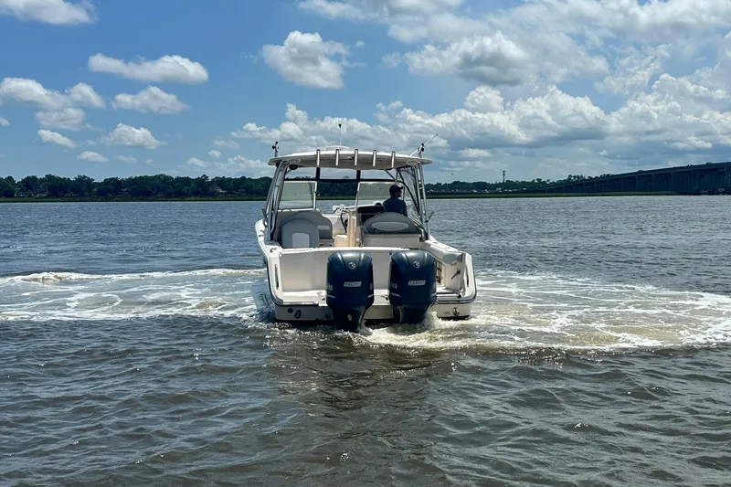 Slide: The Image of 2012 Grady-White Freedom 307 boat cruising on a sunny day with clear skies. - 9
