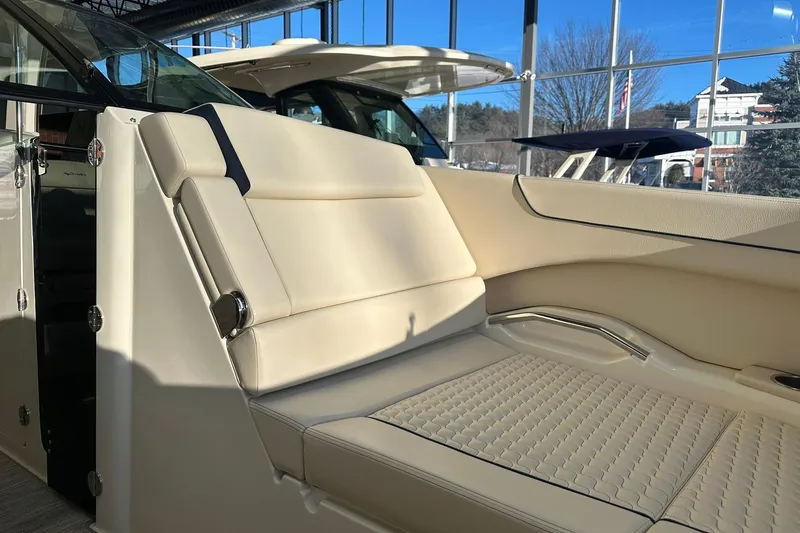 Slide: The Image of 2026 Chris-Craft Launch 31 GT boat interior with luxurious beige seating and modern design. - 21