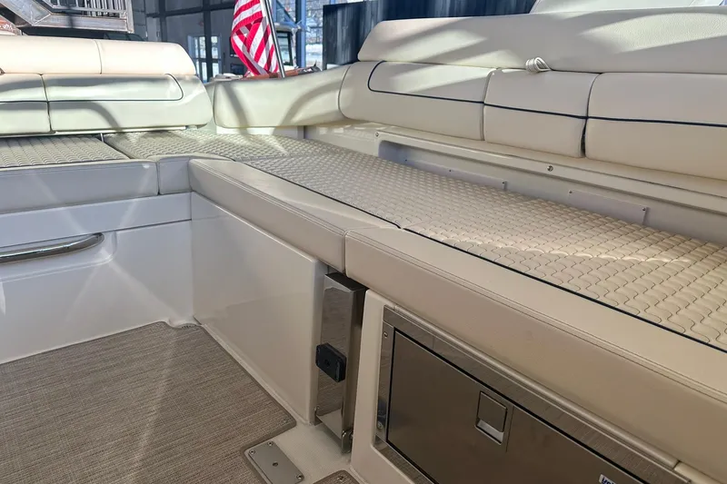 Slide: The Image of 2026 Chris-Craft Launch 31 GT interior with beige seating and American flag. - 27