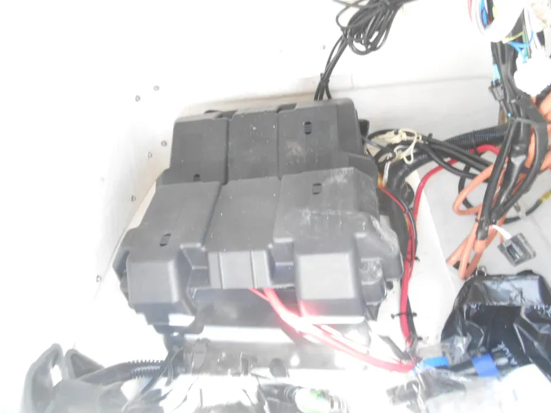 Slide: The Image of Battery compartment of a 2003 Boston Whaler 190 Nantucket boat with wiring. - 11