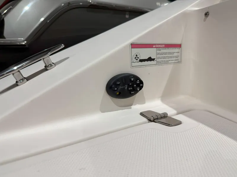 Slide: The Image of 2008 Regal 2000 Bowrider boat interior with control panel and warning label. - 11