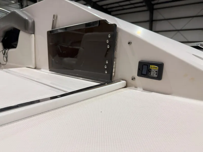 Slide: The Image of 2008 Regal 2000 Bowrider interior detail with warning label and seating area. - 12