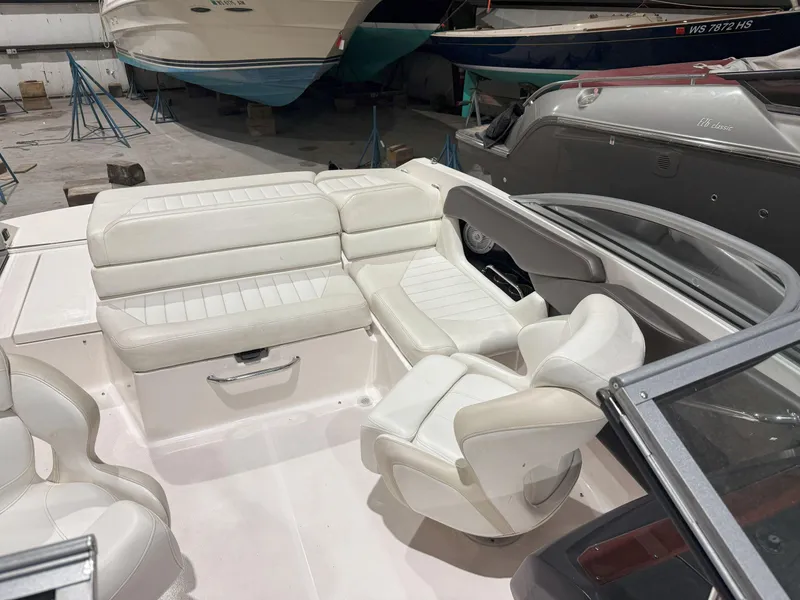 Slide: The Image of 2008 Regal 2000 Bowrider interior with white leather seating in a boat storage area. - 15