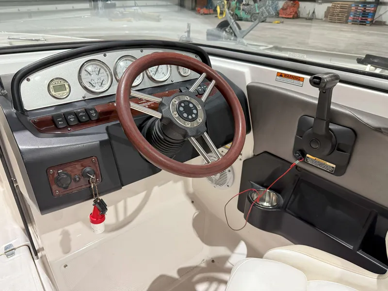 Slide: The Image of 2008 Regal 2000 Bowrider dashboard with steering wheel and control panel. - 17