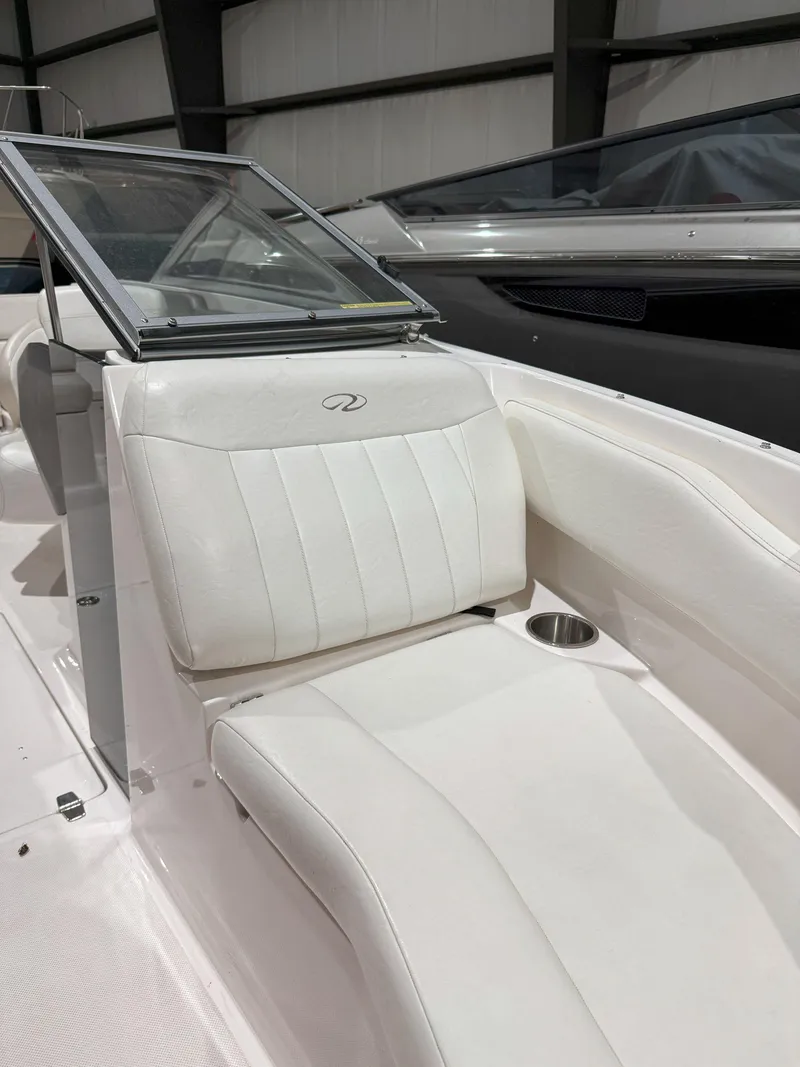 Slide: The Image of 2008 Regal 2000 Bowrider interior with white seating and cup holder. - 21