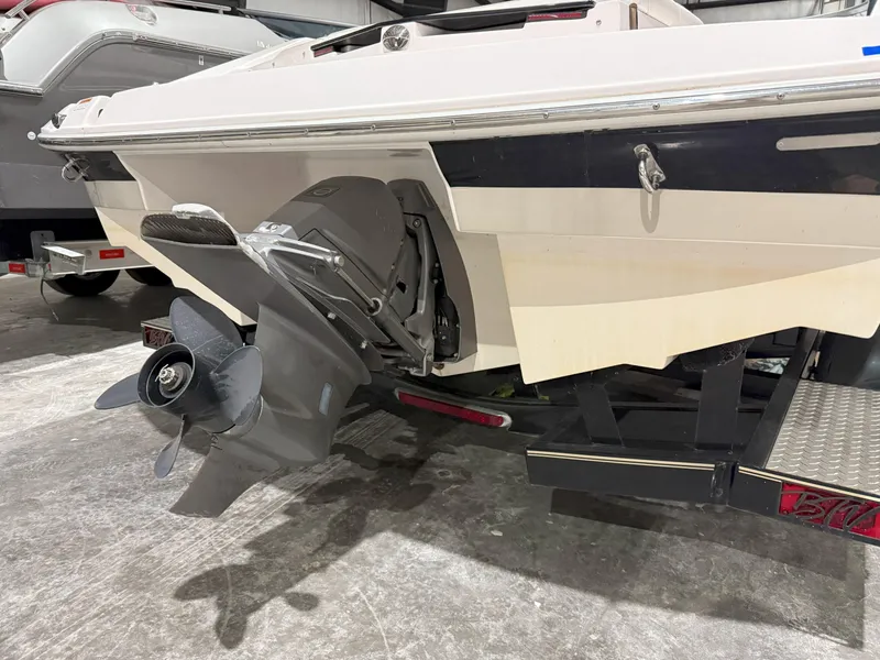 Slide: The Image of Rear view of a 2008 Regal 2000 Bowrider boat on a trailer in a garage. - 6