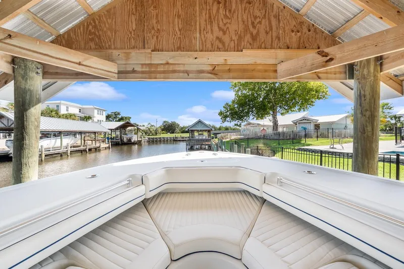 Slide: The Image of 2015 Yellowfin 39 boat interior under a wooden dock canopy. - 30