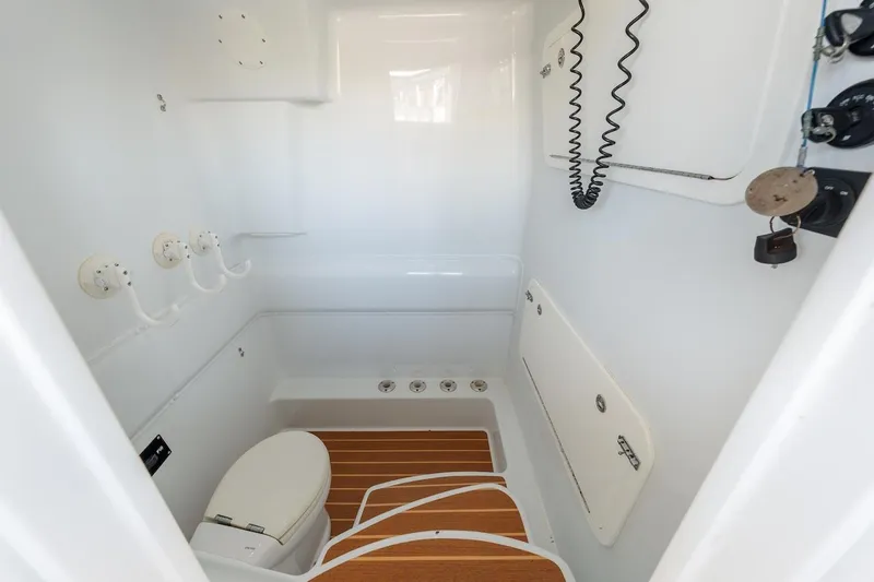 Slide: The Image of 2015 Yellowfin 39 boat interior with white cabin and wooden floor. - 42