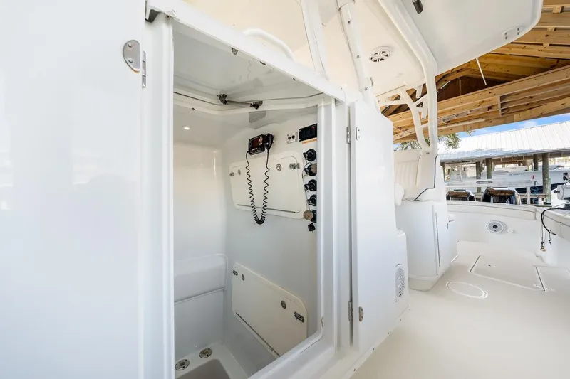 Slide: The Image of 2015 Yellowfin 39 boat interior with toilet and wooden floor accents. - 43