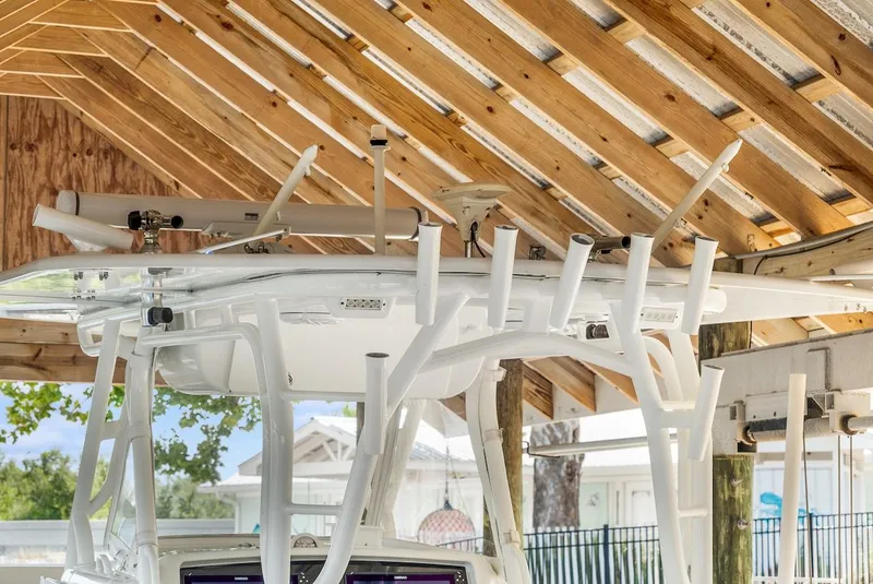 Slide: The Image of Cannon downrigger on 2015 Yellowfin 39 boat deck, featuring control panel and wiring. - 51