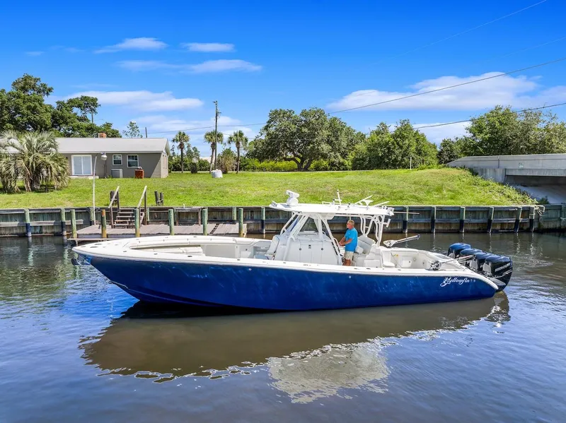 Slide: The Image of 2015 Yellowfin 39 boat on a scenic canal with blue skies. - 8